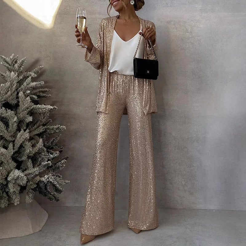 Sparkly women's two-piece sequin set includes a dazzling top and elegant high-waisted pants for evening wear.