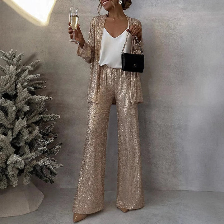 Sparkly women's two-piece sequin set includes a dazzling top and elegant high-waisted pants for evening wear.