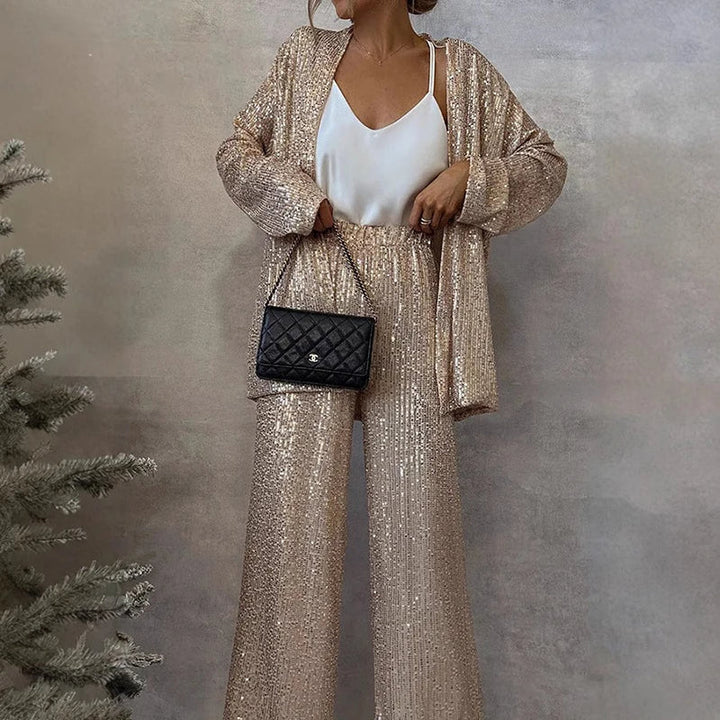 Statement women's sequin two-piece set with a sparkling top and stylish high-waisted pants, ideal for parties.