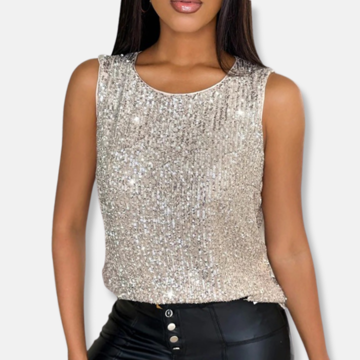 Shiny women's sequin going out top in silver. Sleeveless design, ideal for evening parties & glamorous club wear.