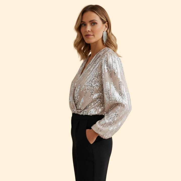 Elegant women's gold sequin wrap blouse with sparkling finish, deep V-neck, and long sleeves. A chic party top.