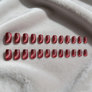 Fashionable wine red cat eye press-on nails. Glossy metallic finish offers easy application & a chic, reusable look.