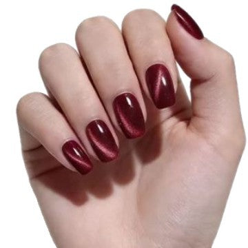 Reusable wine red cat eye press-on nails with a glossy metallic finish. Elegant artificial nails for a sophisticated look.