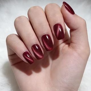 Women's glossy wine red cat eye metallic press-on nails. Stunning artificial nails for easy application & a stylish finish.