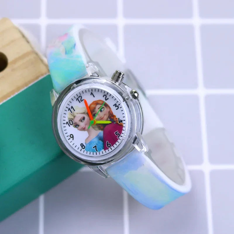 Close-up of Frozen glow-in-the-dark watch for girls, featuring Elsa & Anna on dial with sparkle.