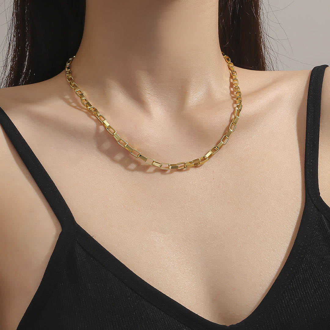 Gold chunky rectangular link chain necklace for women. Bold statement jewelry accessory.