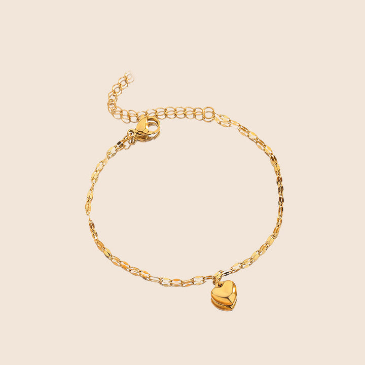 Shimmering gold heart pendant necklace for women, delicate and smooth finish. Adjustable chain.
