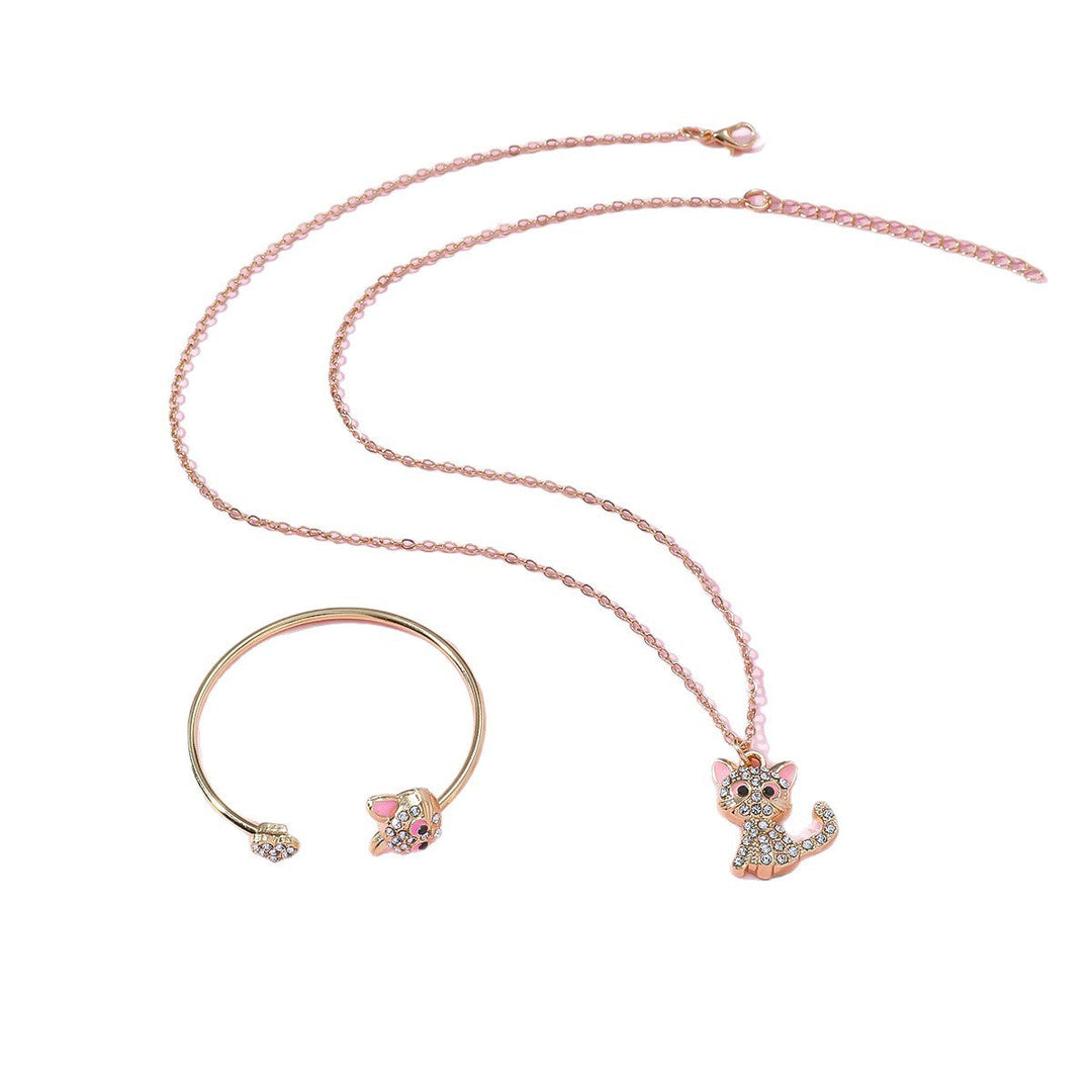 Close-up of the women's playful cat jewelry set, featuring a cute gold-tone cat pendant necklace & ring.