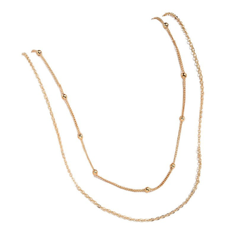 Stackable gold & white layered necklace, elegant women's jewelry, ideal for everyday style.