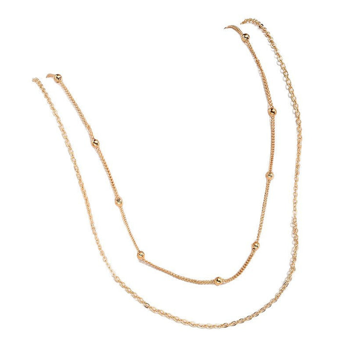 Stackable gold & white layered necklace, elegant women's jewelry, ideal for everyday style.