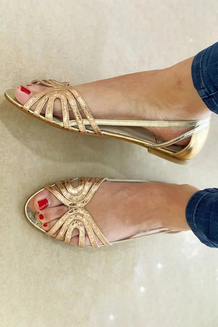 Golden slip-on summer sandals for women, offering effortless style and comfort for warm weather.