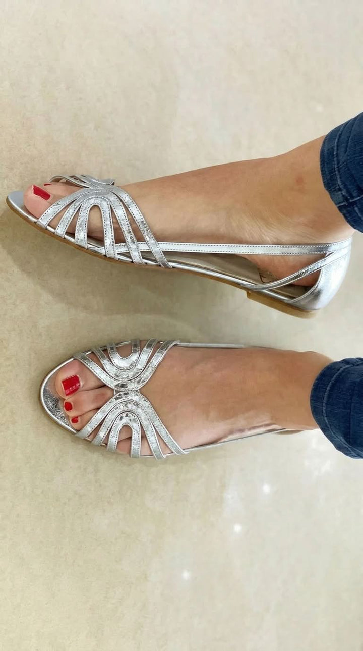 Comfortable women's golden slip-on sandals, perfect for summer casual wear & beach outings.