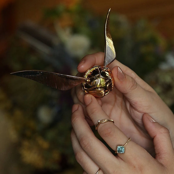 Deluxe golden winged orb, a collectible movable jewelry case. Ideal for treasured rings.