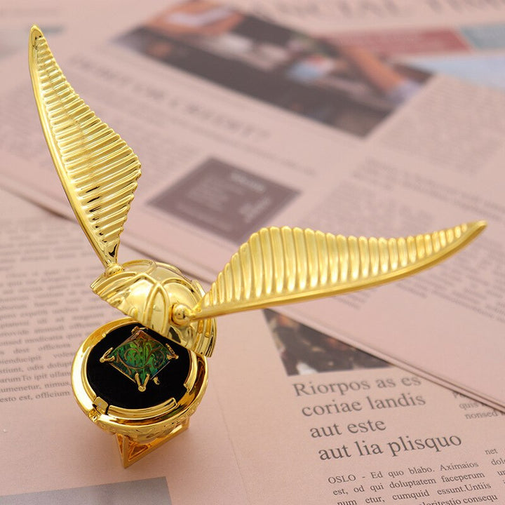 Unisex fantasy golden winged orb jewelry box, a unique movable keepsake for rings.