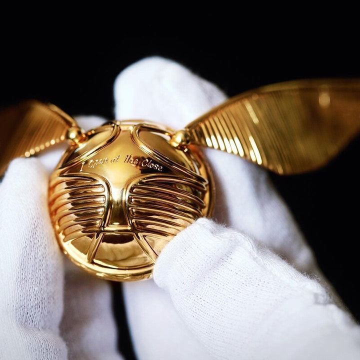 Elegant golden winged orb, a movable luxury ring box. Perfect for special occasions & gifts.