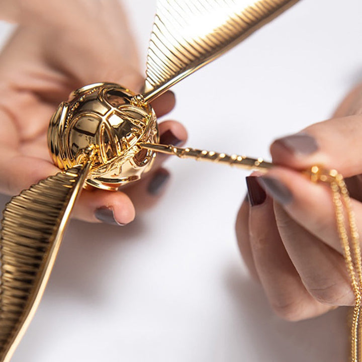 Movable golden winged orb jewelry case, a magical fantasy collector's item for rings.