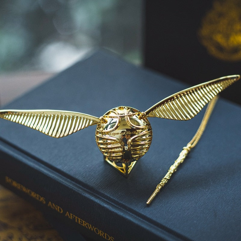 Uniquely designed golden winged orb, a luxury movable ring and jewelry storage box.