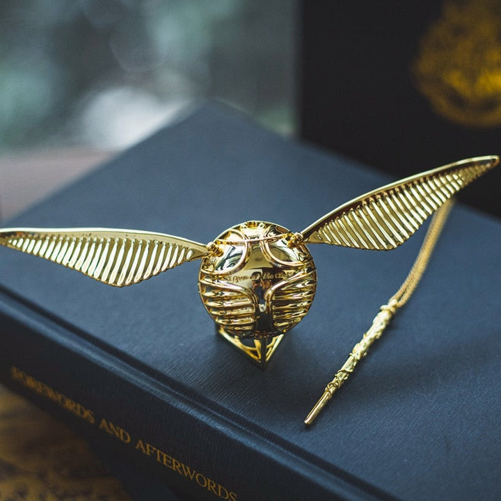 Uniquely designed golden winged orb, a luxury movable ring and jewelry storage box.