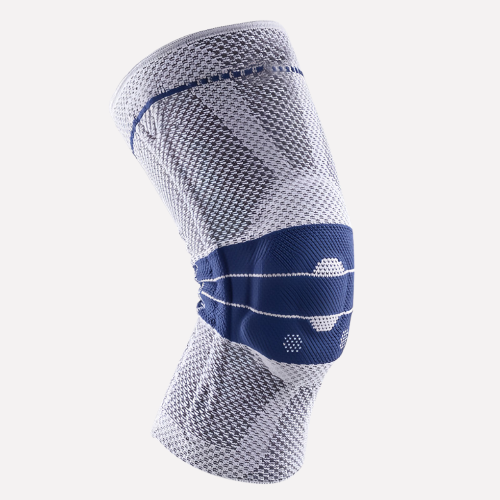 Gray unisex silicone knee sleeve providing comfortable, discreet support for everyday active wear & minor knee pain relief.
