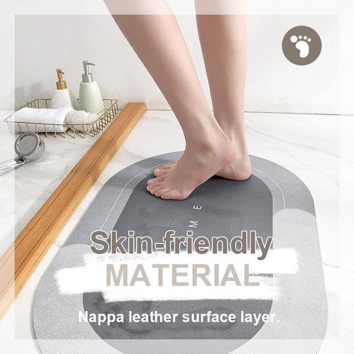 Soft touch blue non-slip oval bath mat, quick-dry bathroom essential for floor protection.