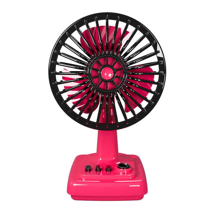 Compact retro desk fan providing personal cooling on a modern home office desk. Ideal small table fan.