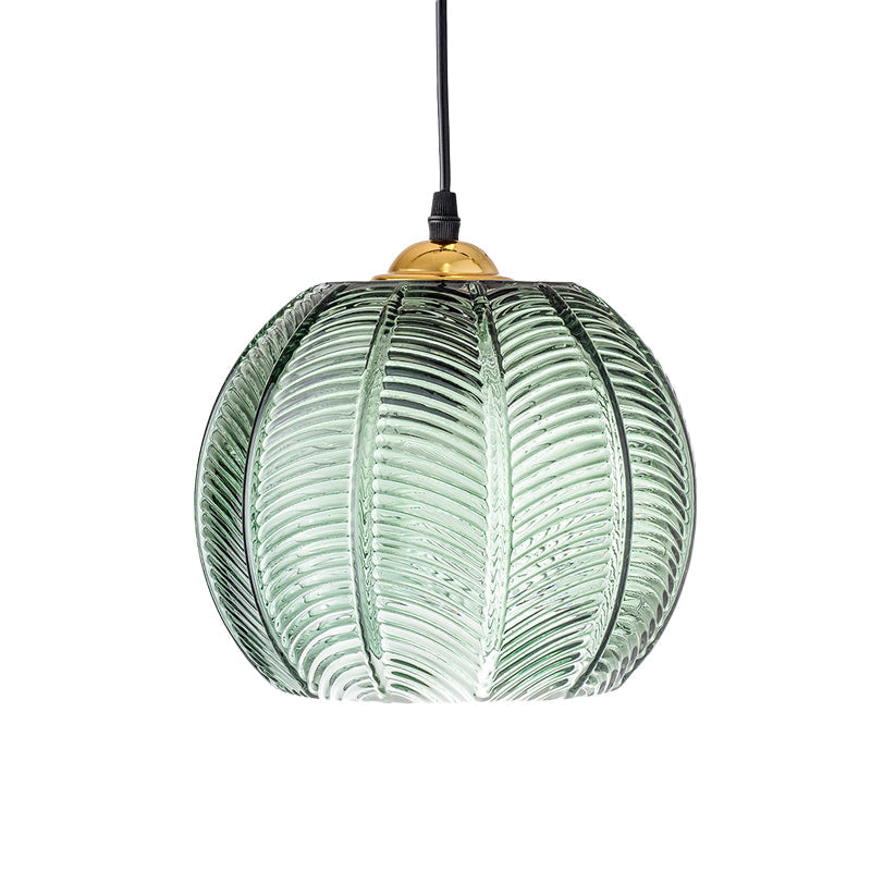 Elegant ribbed green glass dome pendant light, a stylish hanging lamp for kitchen islands and modern home interiors.