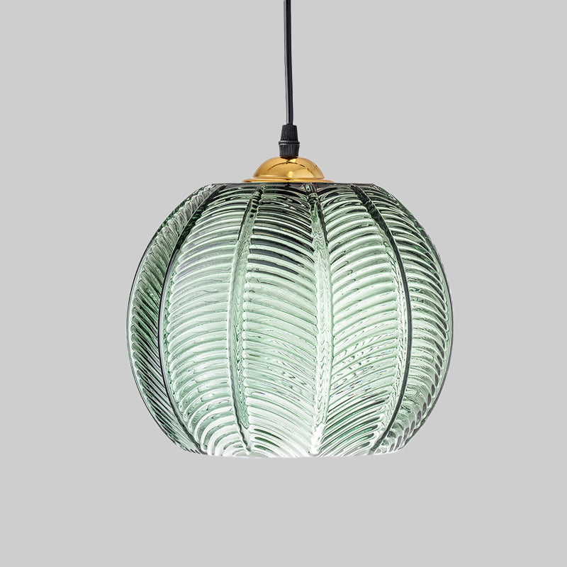 Ribbed glass dome pendant light, a vintage green ceiling fixture providing ambient lighting for home decor.