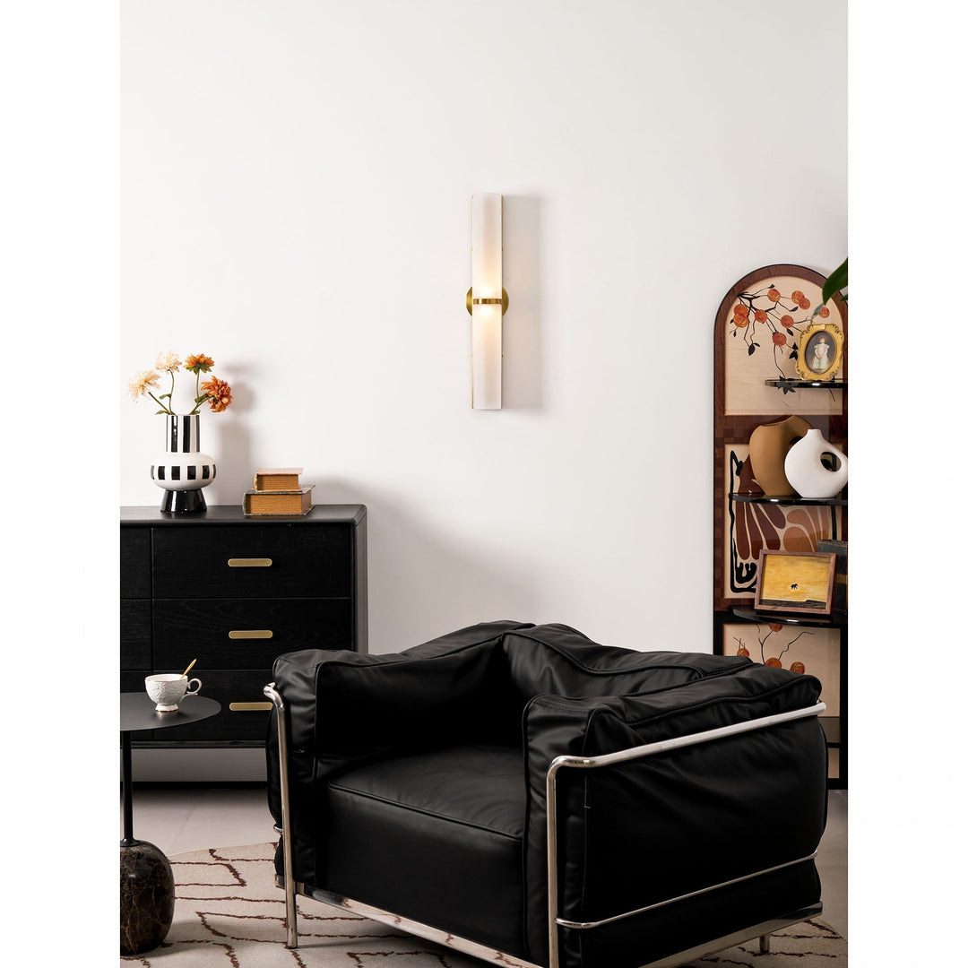 Greymi LED wall lamp. Hand-blown glass, modern lighting. Enhances contemporary home decor.