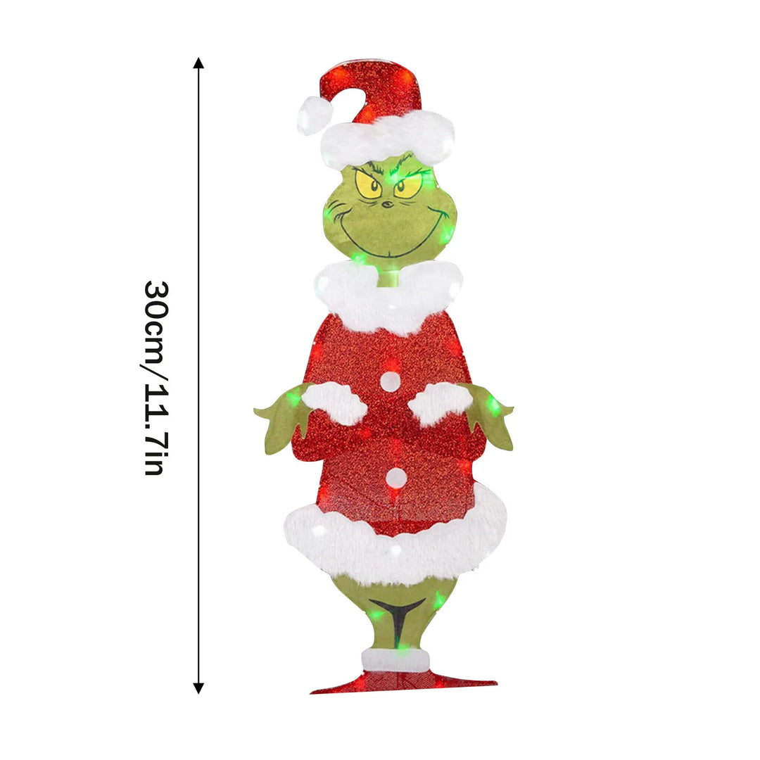 Festive LED Grinch outdoor decoration for a cheerful and bright holiday yard.