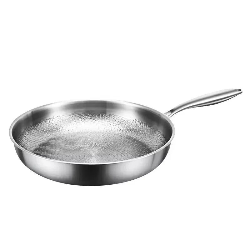Delicious food sizzling in a professional hammered titanium skillet, ideal for induction kitchens.