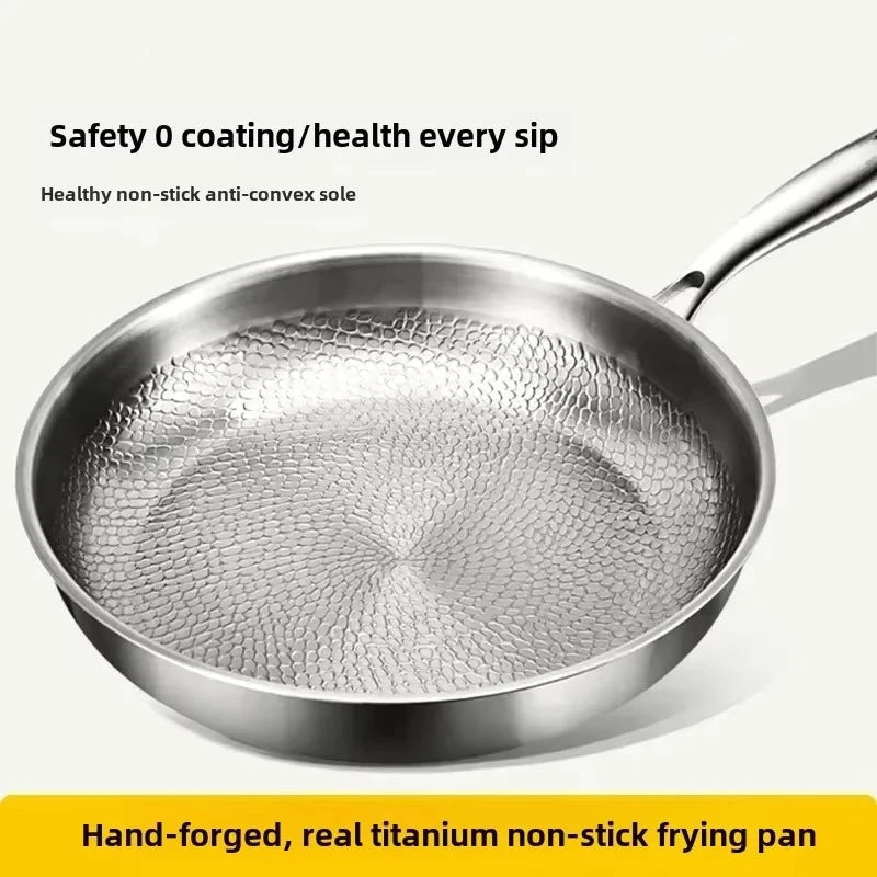 Ergonomic handle of a durable hammered titanium frying pan, designed for comfortable induction cooking.