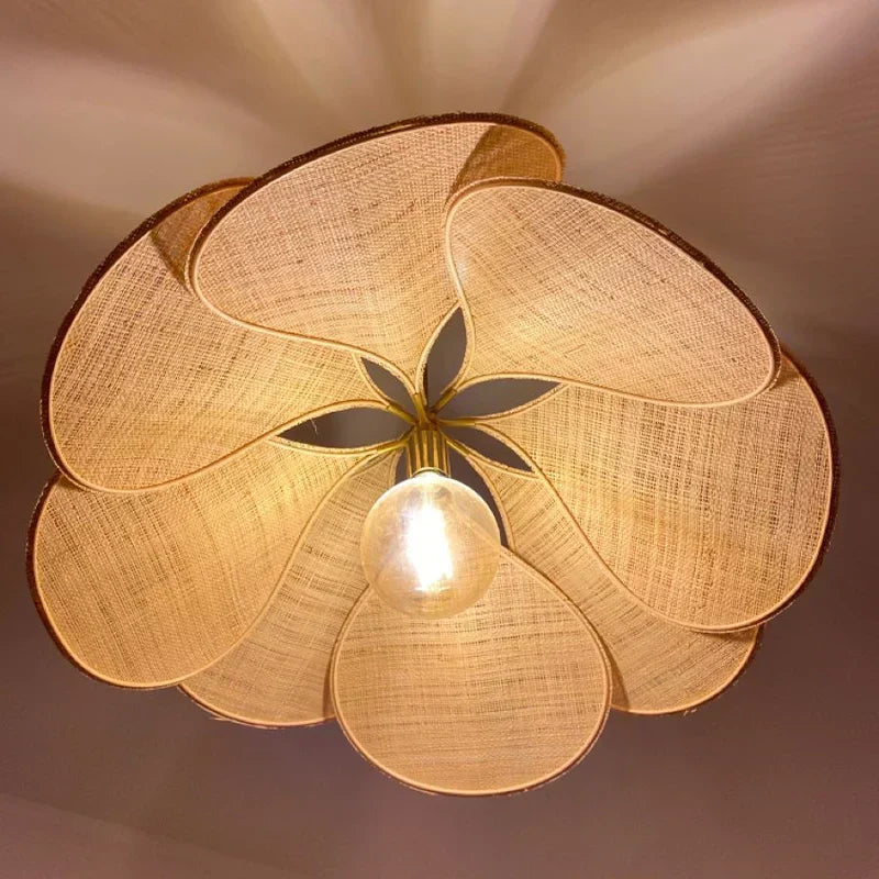 Exquisite hand-woven floral pendant light, natural fabric design, ideal for a decorative and ambient ceiling fixture.