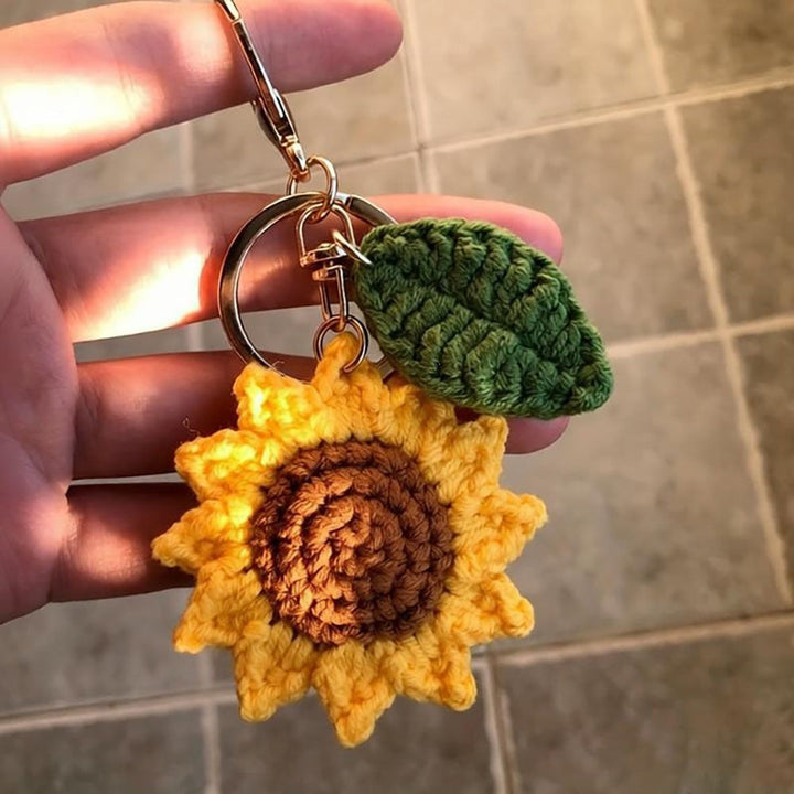 Handcrafted floral crochet keychain with a charming sunflower design. Perfect accessory or gift.