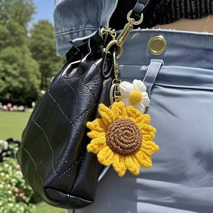 Unique handmade yarn crochet keychain, featuring a vibrant floral sunflower design. Great as a bag charm.