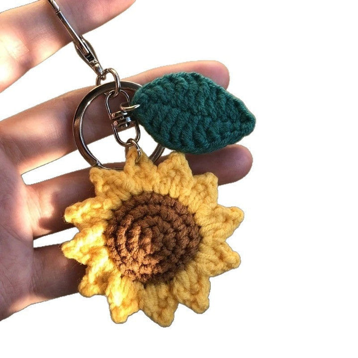 Stylish crochet floral keychain accessory, ideal for keys or as a charming sunflower bag embellishment.