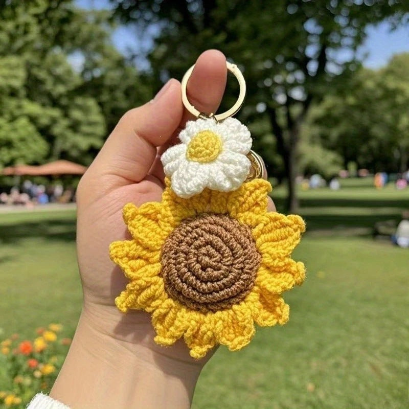 Close-up of a detailed handmade floral crochet keychain, showcasing a beautiful sunflower design.