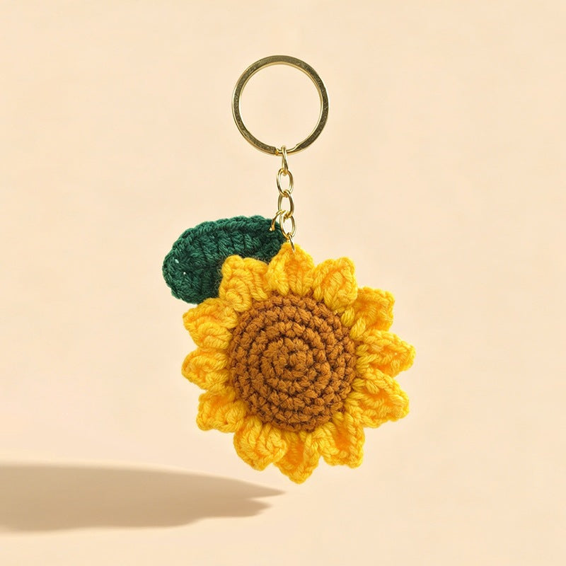 Charming floral crochet sunflower keychain, a delightful handmade accessory. Perfect for keys or bags.