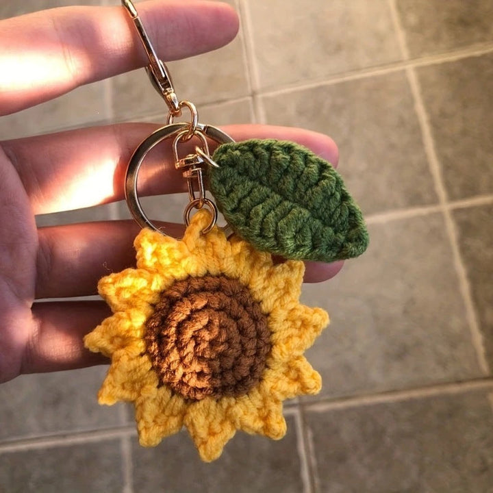 Artisan handmade crochet keychain, featuring a lovely floral sunflower design. Ideal bag or key accessory.