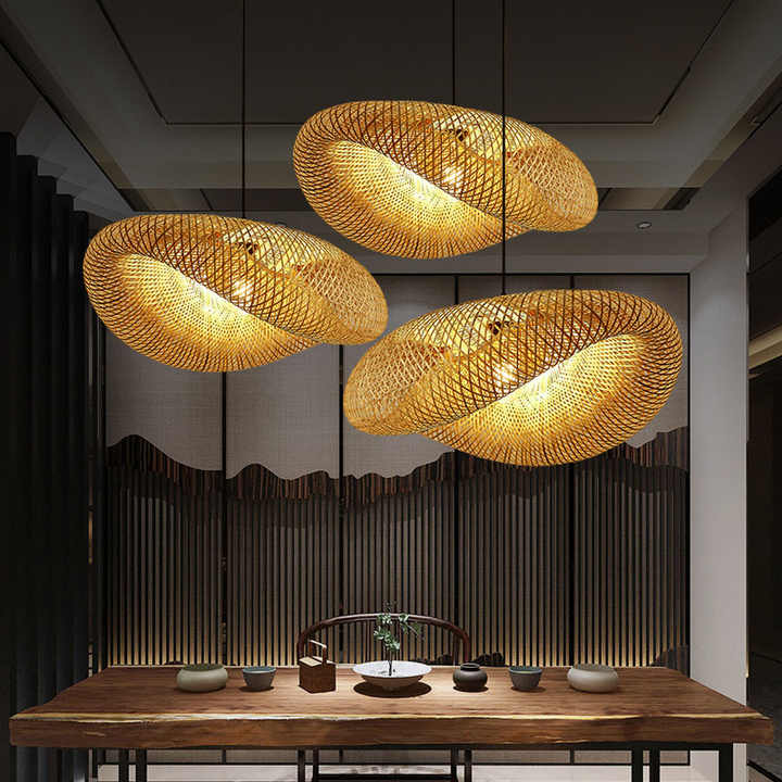 Handcrafted natural bamboo pendant light with intricate wicker rattan shade, perfect for eco-friendly home decor.
