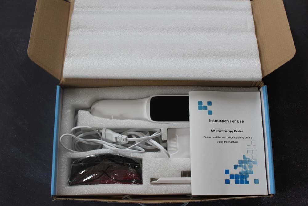 Ergonomic handheld UVB light therapy lamp designed for targeted treatment of psoriasis and vitiligo.
