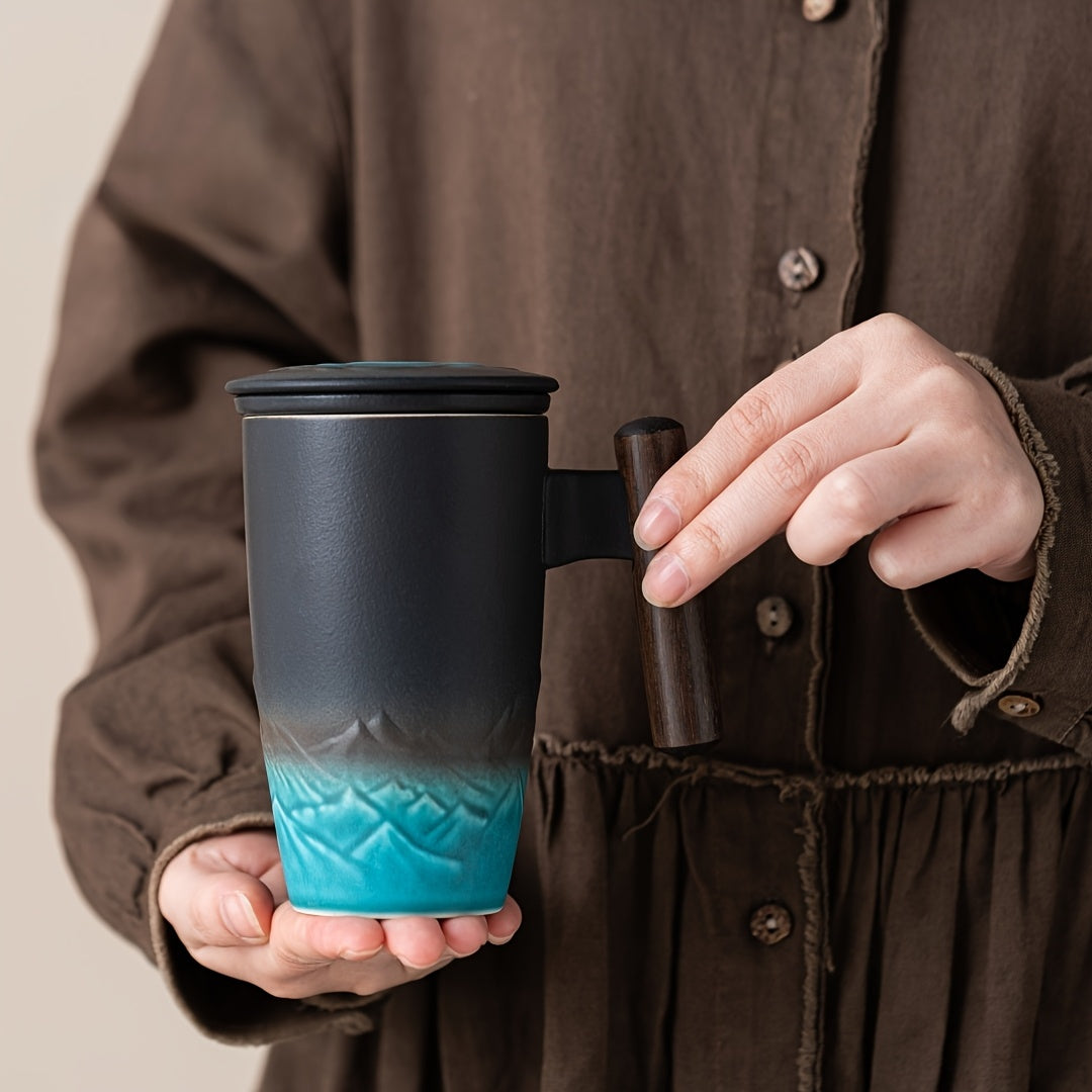 Artisan handmade ceramic tea mug & strainer, ideal drinkware for loose leaf tea enthusiasts.