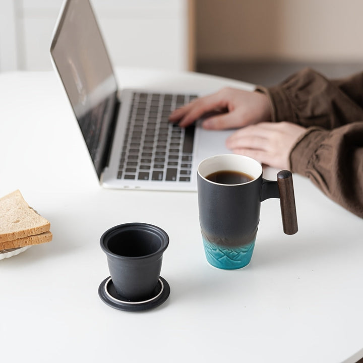 Beautiful handmade ceramic tea mug with integrated tea strainer for loose leaf brewing.