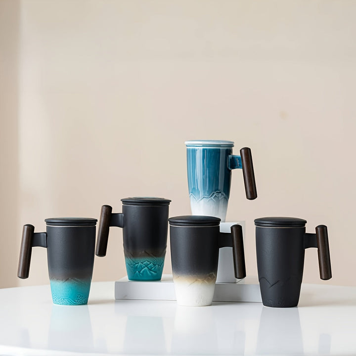 Premium handmade ceramic tea mug & strainer, essential drinkware for brewing loose leaf tea.