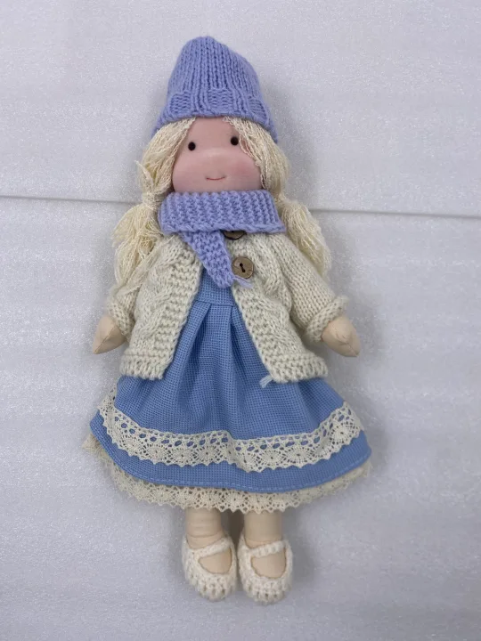 Soft, handmade Waldorf doll crafted from natural, durable materials, an heirloom toy for children's imaginative play.