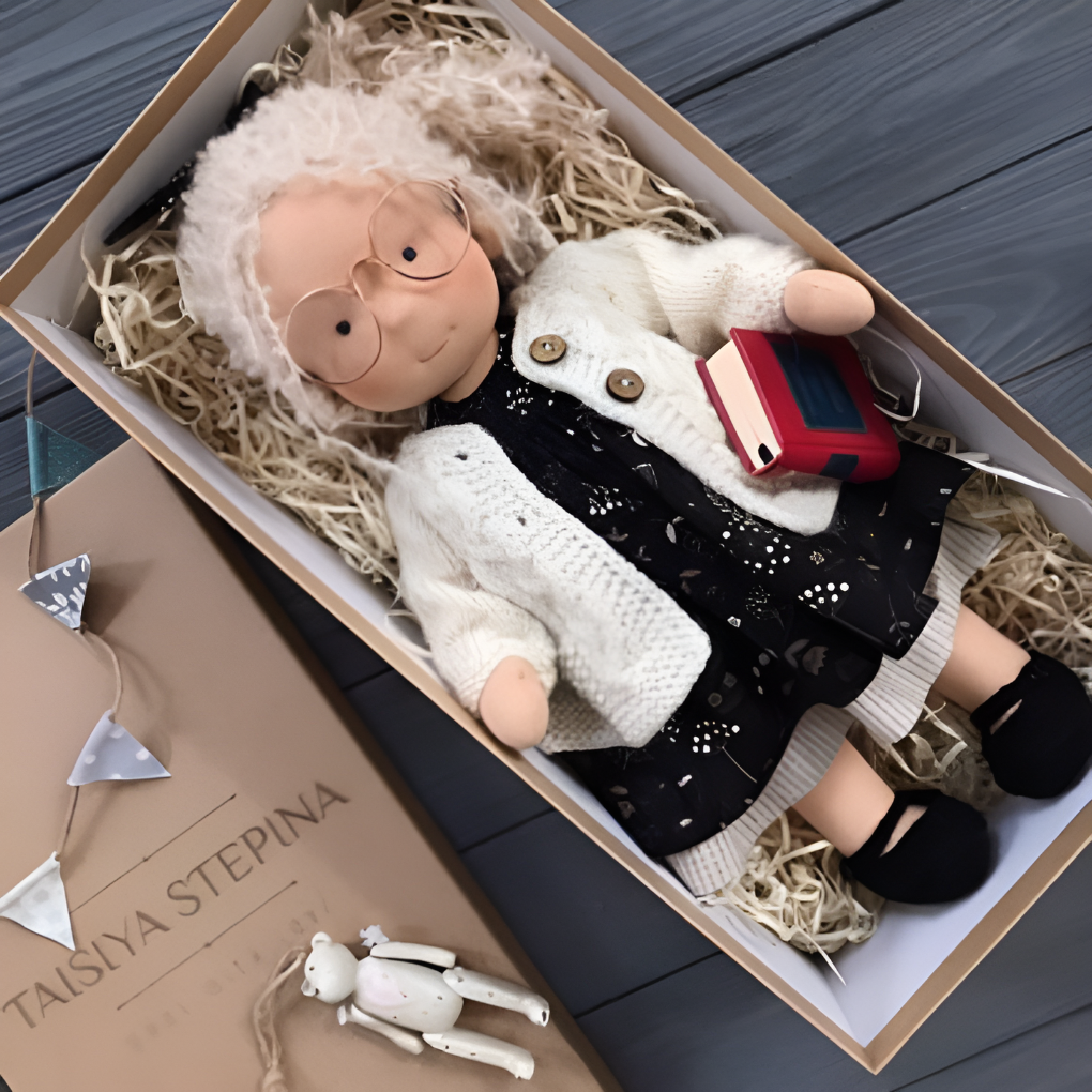 Handmade Waldorf cuddly doll, natural cotton & wool, perfect for toddlers' imaginative play.