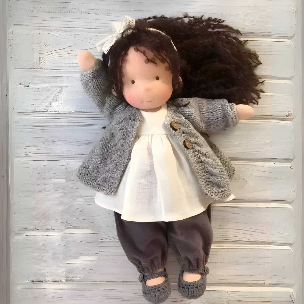 Waldorf doll, handmade from natural wool, a soft cuddly toy for kids' imaginative play.