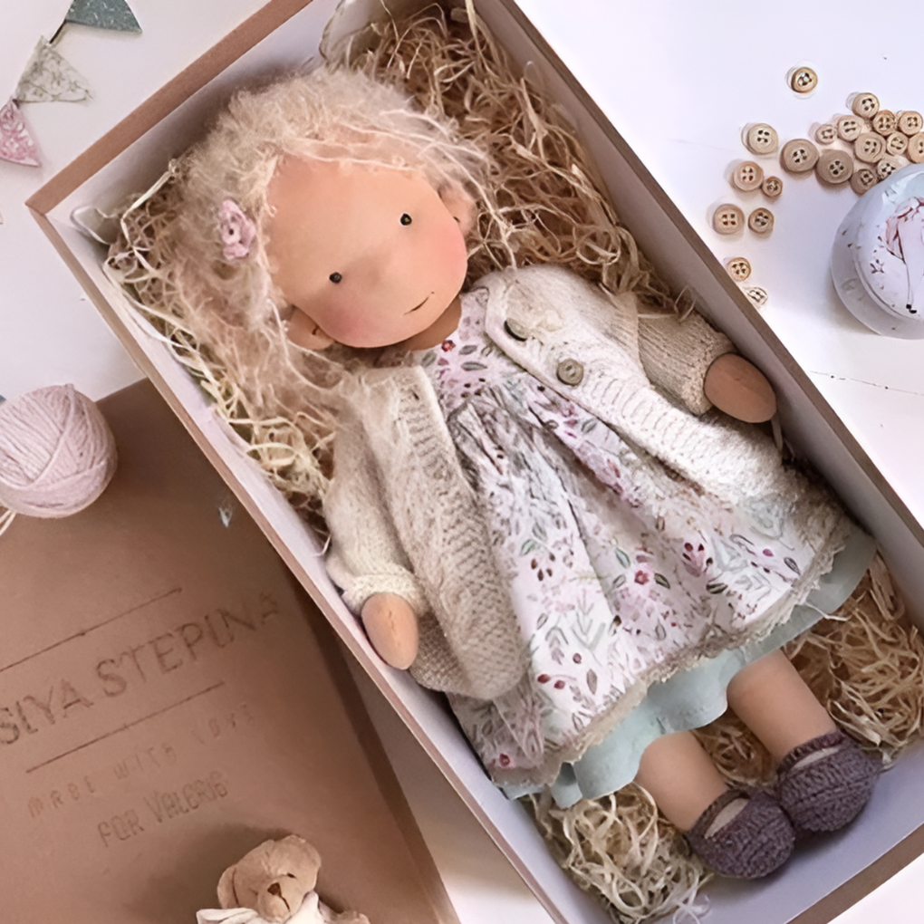 Handmade soft wool Waldorf doll, cuddly, natural toy for toddlers' imaginative play.