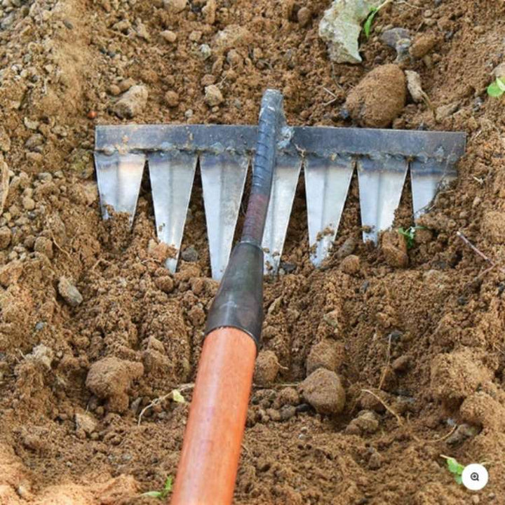 Versatile steel garden rake, a robust hand tool for heavy-duty weeding and soil prep.