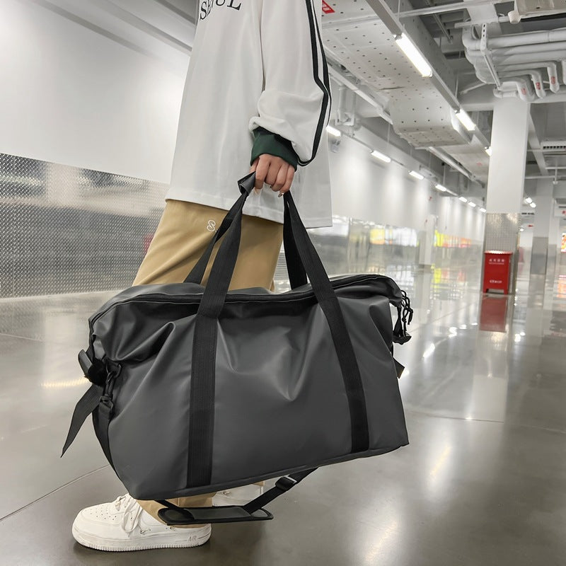 Heavy-duty waterproof outdoor duffel bag for adventure travel, sports, and gym. Unisex design, durable luggage.