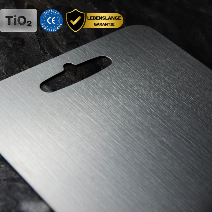 Close-up of a non-porous titanium cutting board surface, ensuring hygienic food safety.